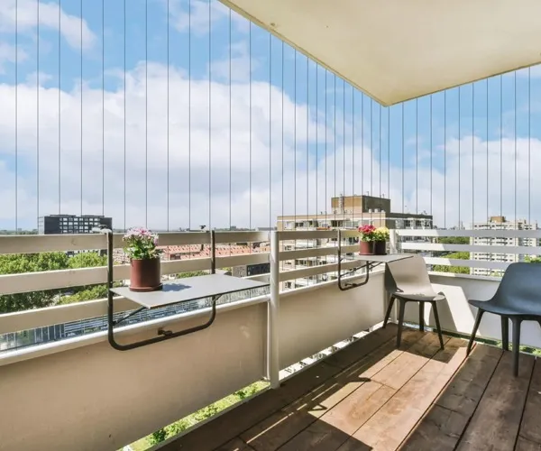 Stainless steel invisible grill fitted to a balcony railing